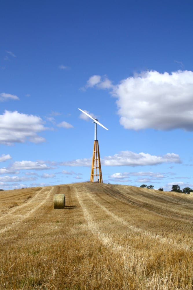 Dalifant small wind turbine on a wooden tower on the farm land