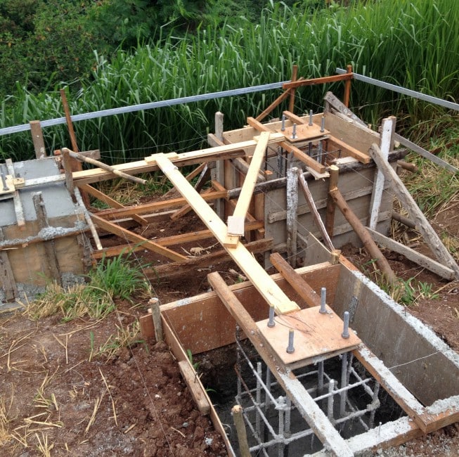 Concrete foundation in process of creation