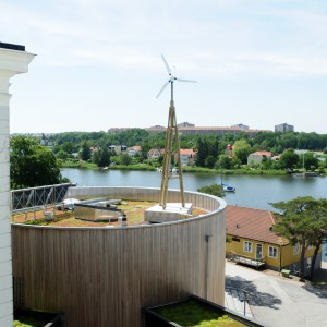 Dali Performance small wind turbine on a wooden tower installed on a roof of Blekinge Technical Institute BTH