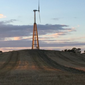 Dalifant small wind turbine 11 kW on a wooden tower at sunset
