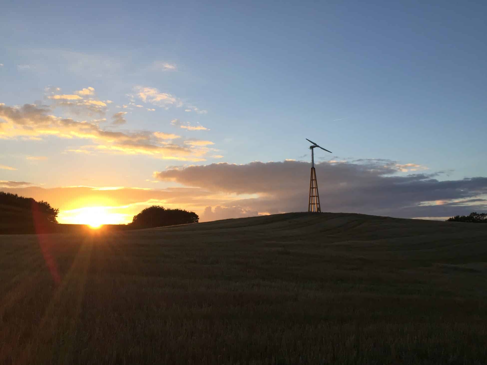 Dalifant small wind turbine 11 kW on a wooden tower at sunset
